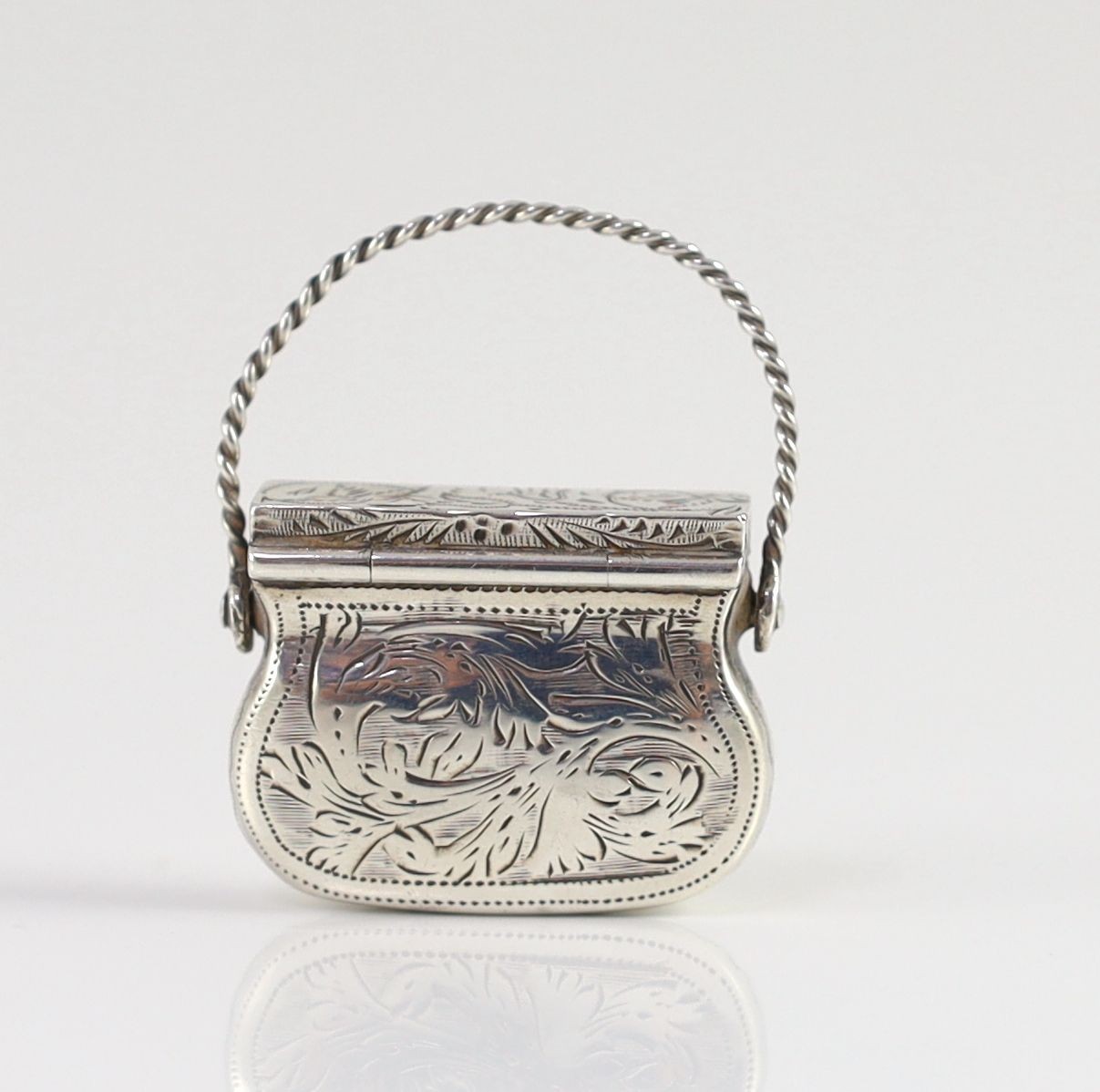 A George IV engraved silver vinaigrette, modelled as a handbag, by Gervase Wheeler